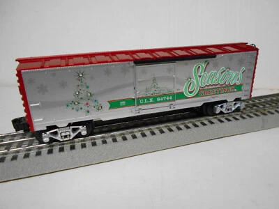 LIONEL 2123100-S CHRISTMAS LIGHT EXPRESS SEASONS GREETINGS BOXCAR MUTI COLOR LED - Image 1 of 4
