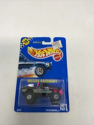 Camión de carrocería dura Nissan 131 negro rosa azul tarjeta de plástico suelto en burbujeante Hot Wheels Foto 1 de 4