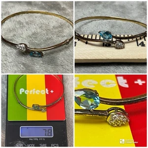 Beautiful Sterling Silver Marked 925 Gold Tone Blue Topaz Bypass Bracelet By HN - Picture 1 of 10