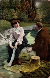 Woman Showing Stocking Leg to Man on River RISQUE c1909 Postcard - Picture 1 of 2