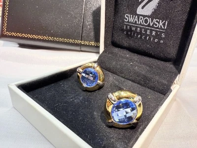 Gold-tone metal cufflinks with faceted blue crystals from Swarovski Jewelers - Image 1 of 4