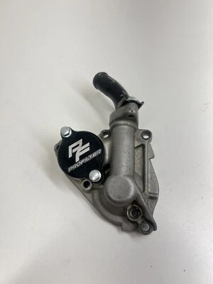 2005 KAWASAKI KX250F TAMPA DA BOMBA DE ÁGUA 16142-0020 SERVE 2005-2016 KX250F - Imagem 1 de 4