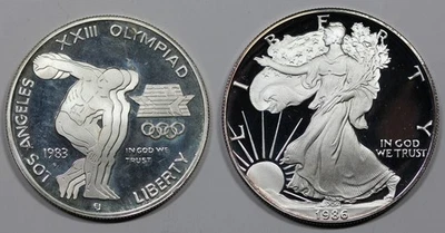 Pair of Proof Silver - 1983-S Olympic Commemorative $1, 1986-S Silver Eagle - Image 1 of 2