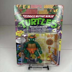 TEENAGE MUTANT NINJA TURTLES MICHELANGELO WITH STORAGE SHELL ACTION FIGURE - Picture 1 of 7