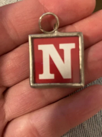 2 Vintage Nebraska Football Necklace Pendents Cover