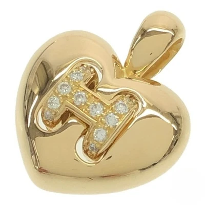 Colgante de diamantes de oro amarillo de 18 k con logotipo H de corazón Olympe vintage de Hermes Foto 1 de 4