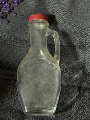 VTG  SYRUP  BOTTLE WITH RED TIN LID -8"  X  3.5" W - Image 1 of 2