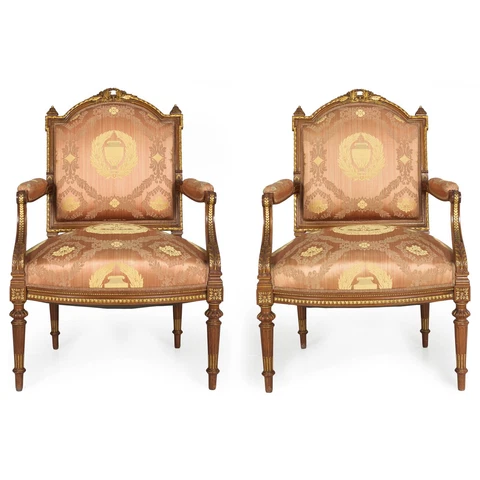 Pair of French Louis XVI Style Parcel-Gilt Highlighted Walnut Arm Chairs Cover