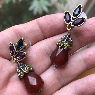 Pendiente floral con gota de flores firmado por Heidi Daus perforado Foto 1 de 3