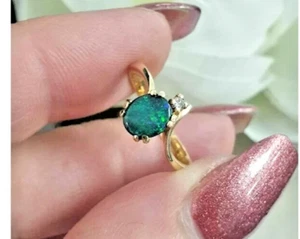 Juego de garras de diamante y ópalo 14 quilates tamaño K 1/2 pesos 2,09 gramos valoración@$1732 - Imagen 1 de 4
