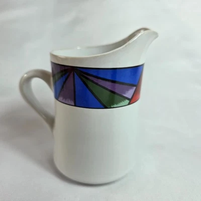 Sakura Sunset Mountain Creamer with Lid White with Multicolor Border - Image 1 of 4