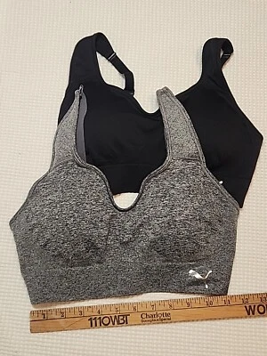 2 Sujetadores deportivos Puma medianos negros grises  Foto 1 de 4