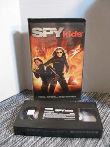 VHS Band - Dimension Heimvideo - Spion Kinder - schwarz Klappschale - 2001 - Bild 1 von 9
