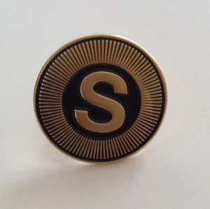 Spilla Stussy Spiral S oro/nero - Foto 1 di 4