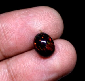 Natural Ethiopian Multi Fire Black Opal Oval Cabochon Loose Gemstone 10x8x6 mm. - Picture 1 of 4