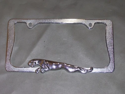 original 2009 Jaguar XF license plate trim cover mount jaguar emblem OEM - Image 1 of 4