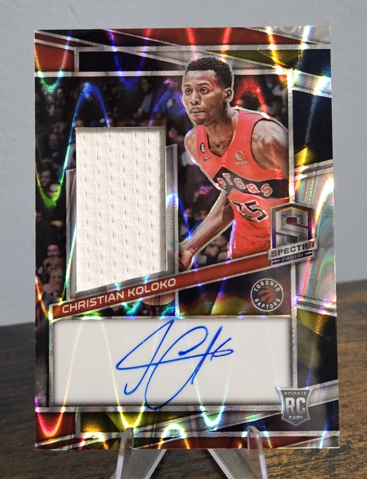 2022-23 Spectra - Rookie Jersey Autographs Christian Koloko #229 Supernova /75 - Image 1 of 2
