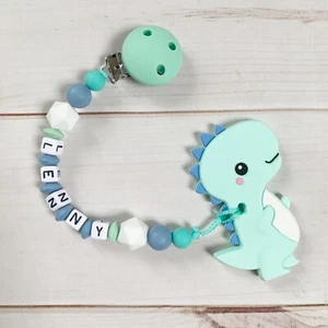 Cadena de mordedura anillo de mordedura con nombre cadena de chupete silicona Dino verde menta azul niño - Imagen 1 de 1
