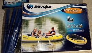 Sevylor 4 Personen Caravelle 9’x 5’ Füße mit zwei (2) Paddeln - Bild 1 von 4