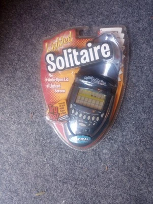 Videojuego electrónico portátil vintage Radica iluminado solitario 2003 Foto 1 de 2