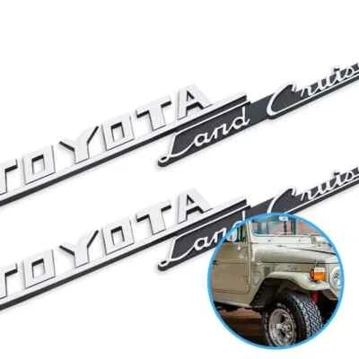 Genuine Toyota 69-74 LAND CRUISER FJ40 SET of 2 Front Fender Emblem 75305-60011 - image 1 of 4