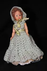 Antique 7" doll with eyes that close, in green crocheted dress and bonnet - Picture 1 of 8