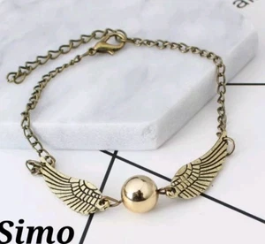 BRACCIALE HARRY POTTER DONNA UOMO BOCCINO D'ORO DONI MORTE BROZO ALI SCONTI - Imagen 1 de 1