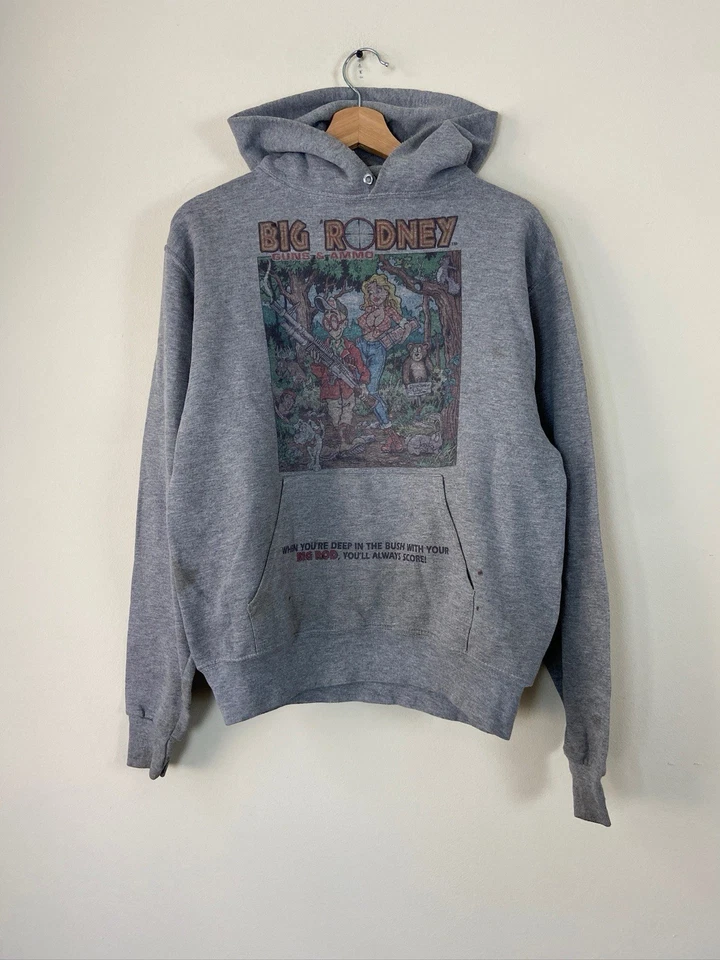 Sudadera con Capucha Gris Arte Cazador Bebé Safari Pistolas y Munición Big Rodney Divertida De Colección - S/M Foto 1 de 4