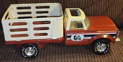 Camión Ford F-100 Ranger rojo de plataforma Nylint Farms Foto 1 de 4