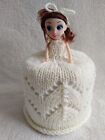 yellow knitted toilet roll doll cover