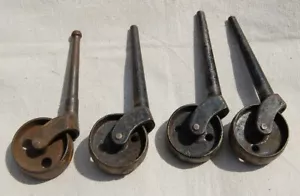 4 CASTERS Set Vintage  WOOD CAST IRON FURNITURE ROLLERS -Nice Patina Taper Shank - Picture 1 of 6
