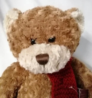 BHS - Brown 43cm Sitting Curly Bear with cream face & paws, Red Knitted Scarf - Image 1 of 4