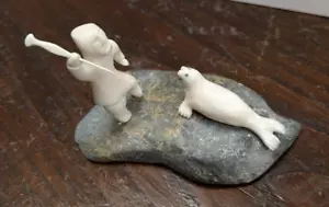 Hand Carved Figure of Hunter and Seal Mounted on Stone - Picture 1 of 11