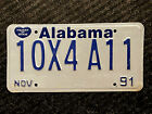 1991 Alabama Classic License Plate "10X4A11" ... HEART OF DIXIE & BLUE ON WHITE 