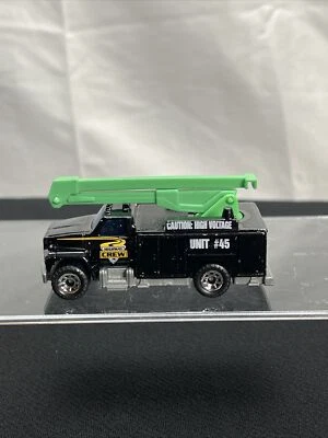 Mattel escala 1:83 Matchbox • Camión con canastilla utilitario Ford negro “Highway Crew” Foto 1 de 4