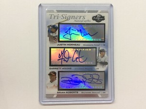 JUSTIN MORNEAU GARRETT ATKINS BRIAN ROBERTS 2007 TOPPS CO-SIGNERS TRI-SIGNERS