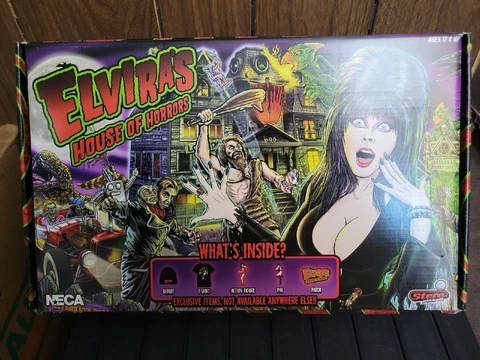 NECA Elvira's House of Horrors Box XL Action Figure, Beanie, Shirt, Pin, Patch! Cover