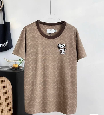 NWT COACH  Women’s Unisex Brown full printed Embroidered Snoopy  T-shirt  COTTON - Image 1 of 4