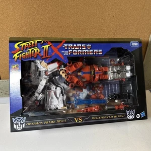 Transformers Street Fighter II x Optimus Prime Ryu vs Megatron M. Bison - Picture 1 of 11