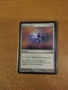 MAGIC THE GATHERING RAVNICA: CITY OF GUILDS SELLO DIMIR LIGERAMENTE TOCADO - Imagen 1 de 2