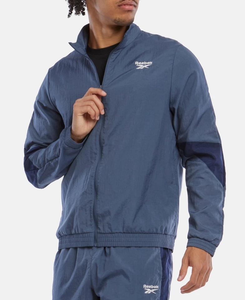 Abrigo Chaqueta de Pista Reebok Hombre Calce Regular Talla S Azul Sólido Foto 1 de 1