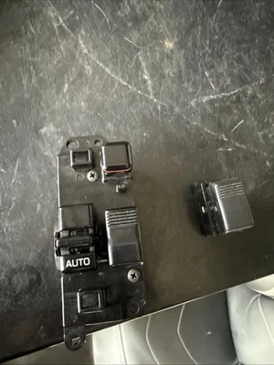 Interruptor de ventana eléctrica para conductor y pasajero Toyota Supra 1986-1989 OEM genuino Foto 1 de 4