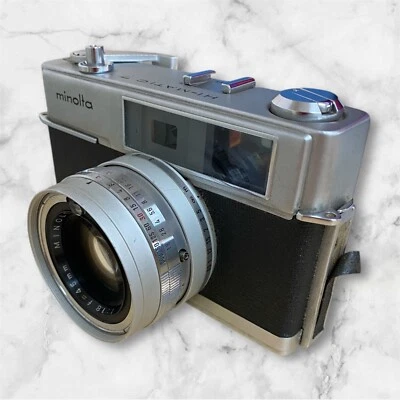 279168 MINOLTA HI-MATIC7 con MINOLTA ROKKOR-PF 1.8 de Japón Foto 1 de 4