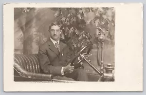Man in Suit Glasses Sitting in a Prop Antique Car PMO c1907-1915 RPPC Postcard - Picture 1 of 2