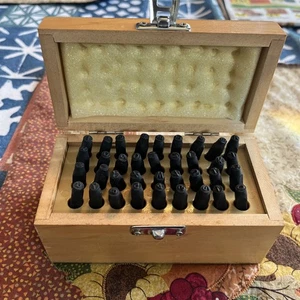 36 Piece Stamping Punch and Die Letter and Number Set A-Z &0-9 Symbol Wood Case - Bild 1 von 3