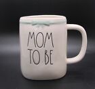 Rae Dunn &quot;Mom To Be&quot; mug white with blue ribbon fold on back NWOT