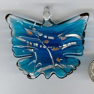 Silver foil blue colored butterfly glass pendant. Very cool butterfly!