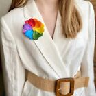 Handmade Prideful Petals LGBTQ pride brooch featuring colorful chamomile design