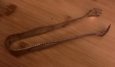 Pinzas de hielo placa de plata moneda extra vintage de principios de 1900 Foto 1 de 4