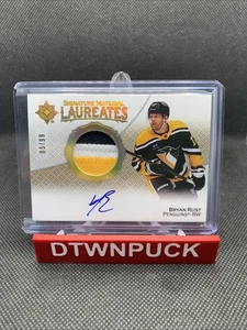 2022-23 Upper Deck Ultimate #SML-BR Signature Matieral Laureates Bryan Rust /99 - Picture 1 of 2